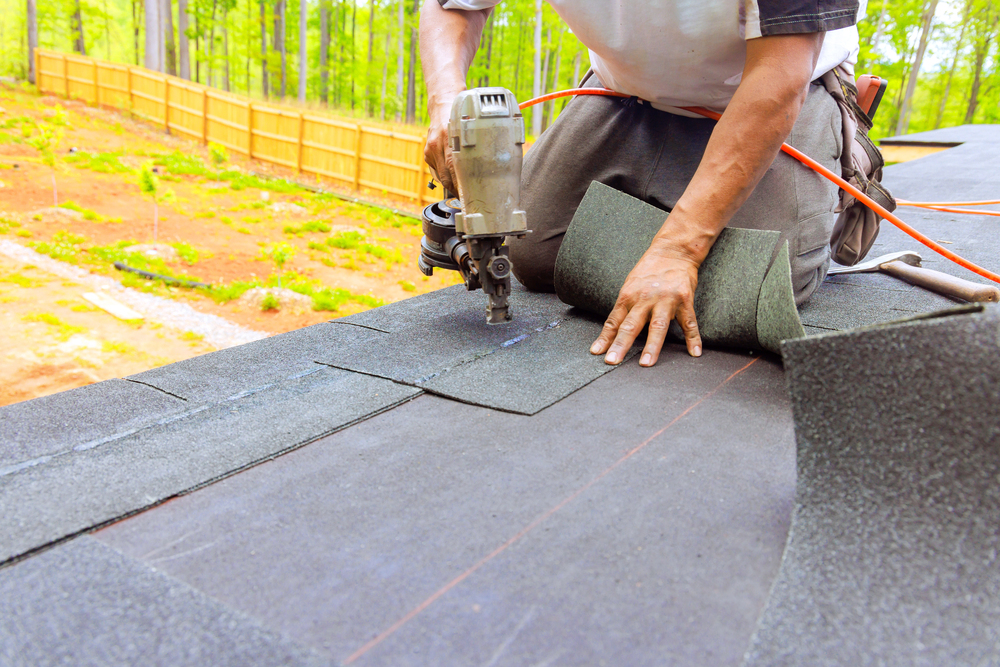 Roofing team installing 30, 40, 50-year asphalt shingles